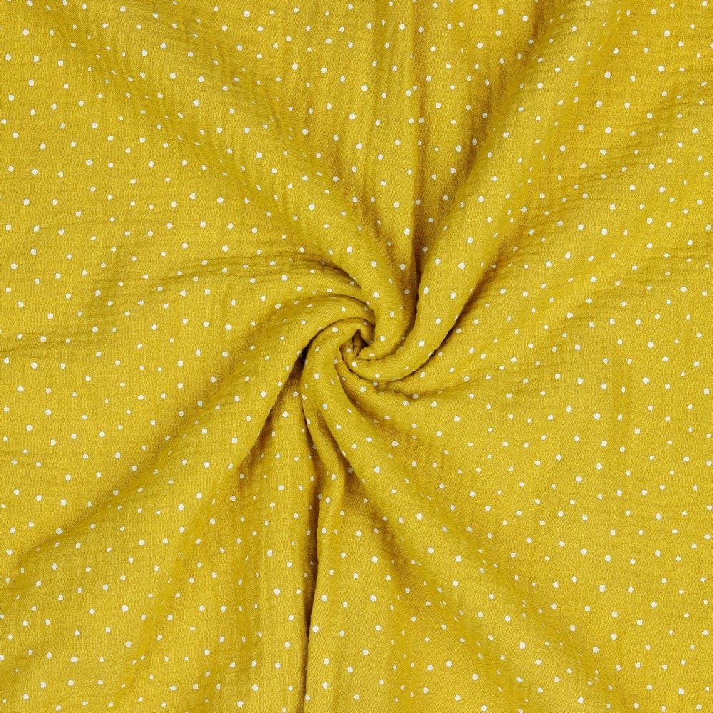 Muslīns-punktiņi uz medus dzeltena fona 130 g/m²